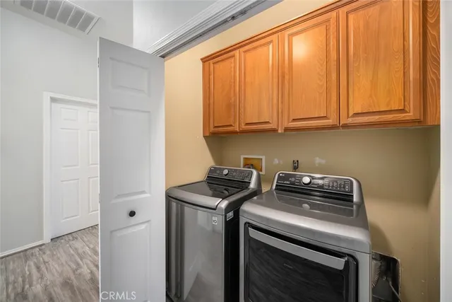 a view of storage and utility room with washer and dryer