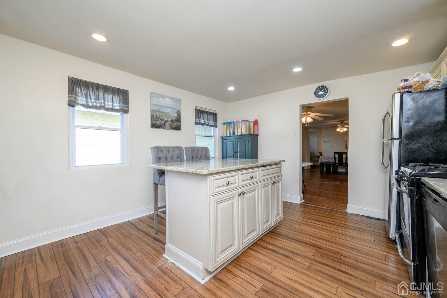 245 Washington Street Mount Holly, NJ 08060 - Photo 14 of 25 a kitchen with granite countertop a stove top oven and sink