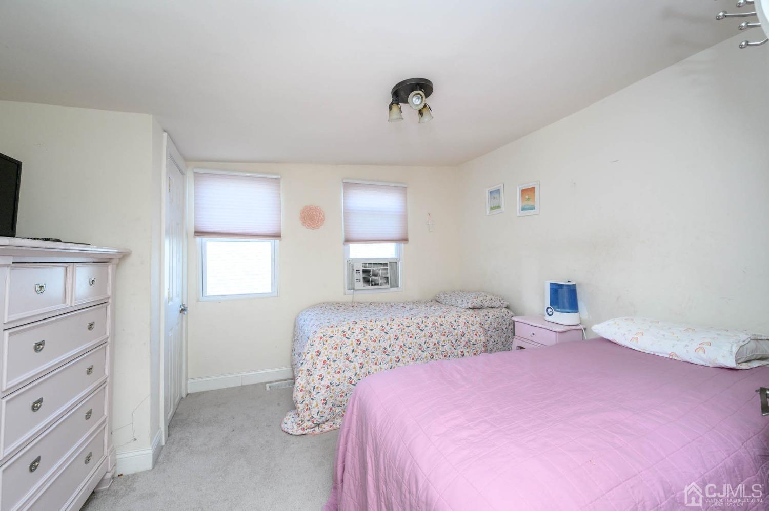 245 Washington Street Mount Holly, NJ 08060 - Photo 16 of 25 a bedroom with a bed and a window