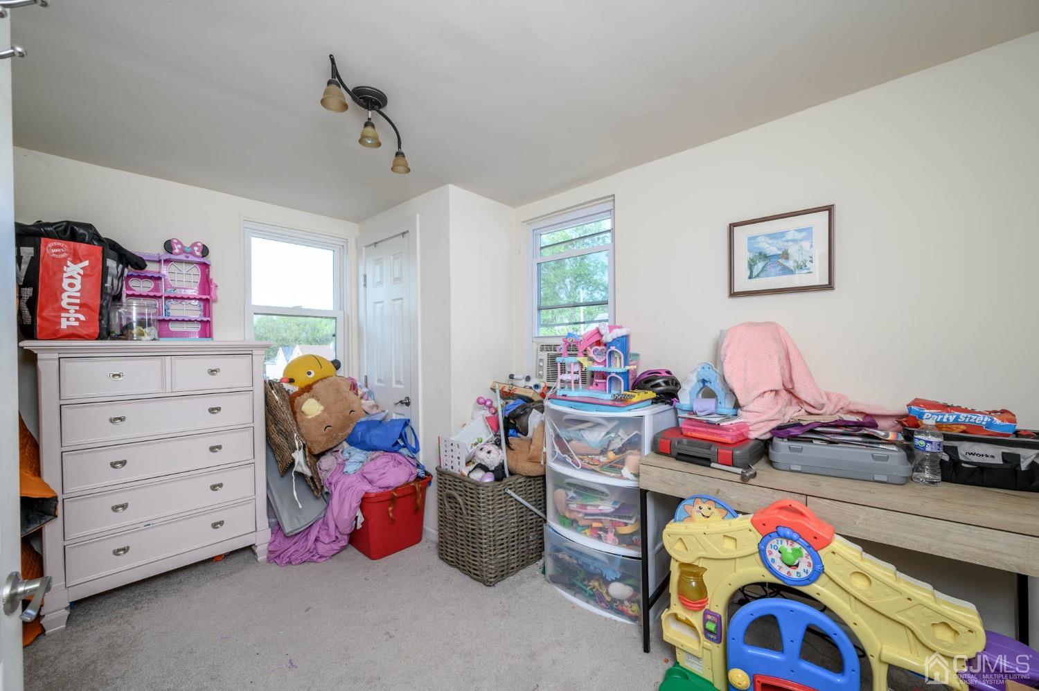 245 Washington Street Mount Holly, NJ 08060 - Photo 19 of 25 a bedroom with a bed and a window