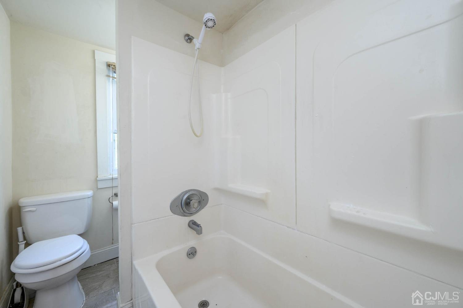 245 Washington Street Mount Holly, NJ 08060 - Photo 20 of 25 a bathroom with a sink and a toilet