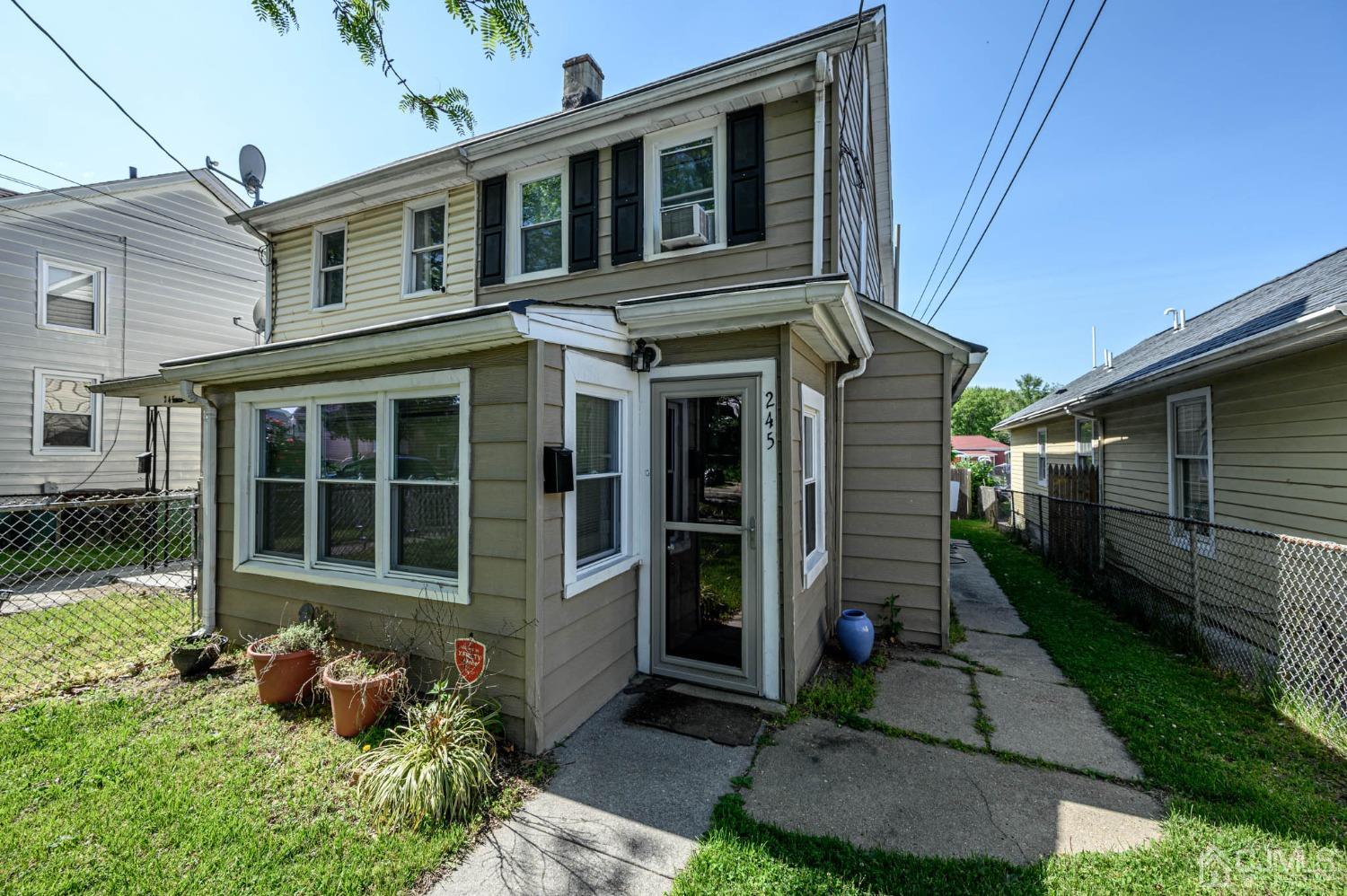 245 Washington Street Mount Holly, NJ 08060 - Photo 2 of 25 a front view of a house with garden