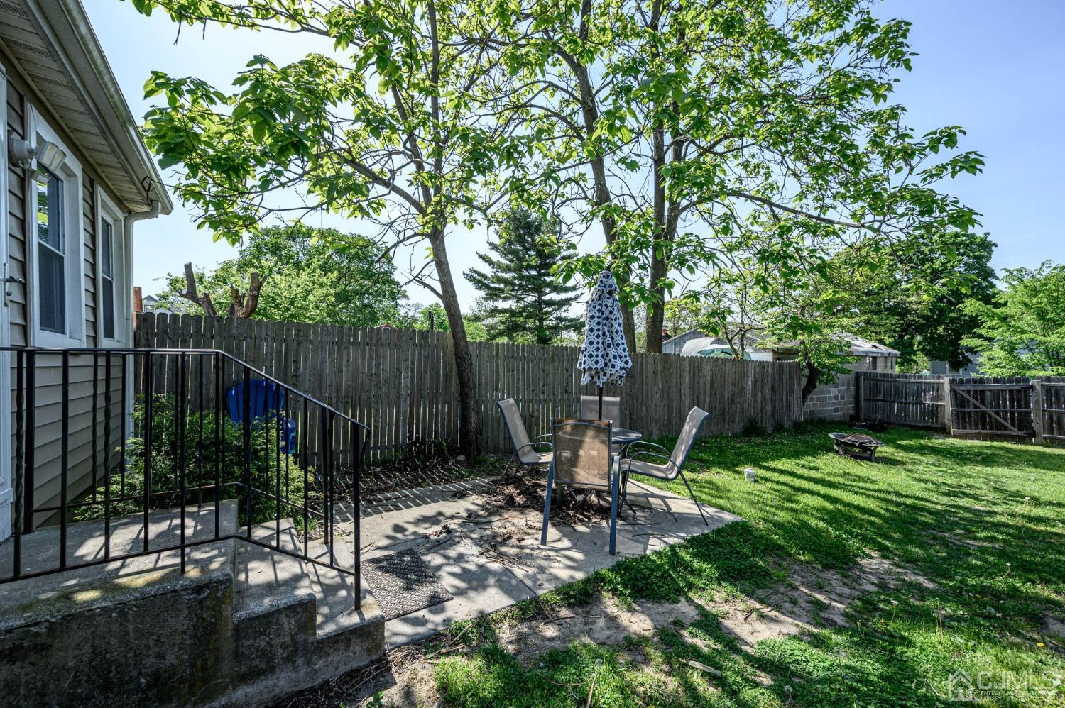 245 Washington Street Mount Holly, NJ 08060 - Photo 22 of 25 a view of chair and table in backyard of the house