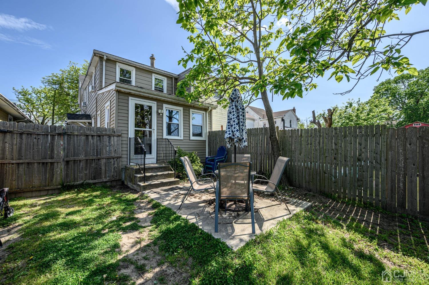 245 Washington Street Mount Holly, NJ 08060 - Photo 23 of 25 a view of a chair and table in backyard of the house