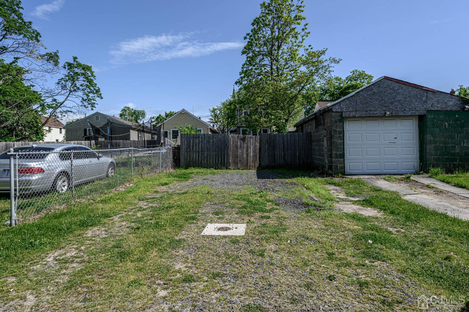 245 Washington Street Mount Holly, NJ 08060 - Photo 25 of 25 a backyard of a house with table and chairs