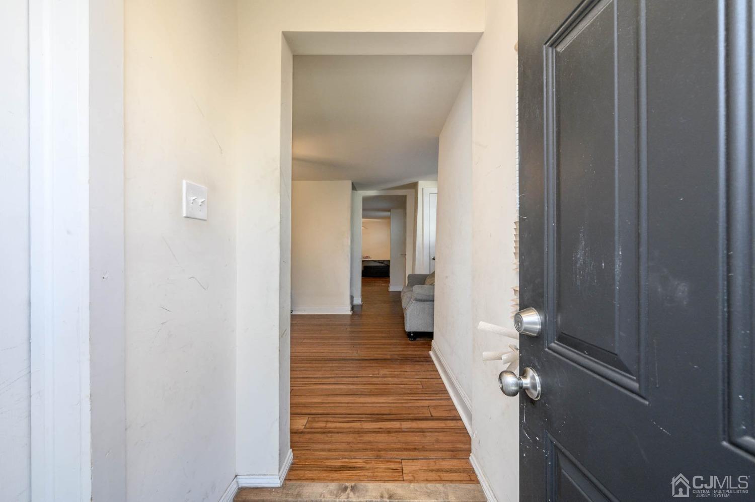 245 Washington Street Mount Holly, NJ 08060 - Photo 3 of 25 a view of a hallway with a glass door