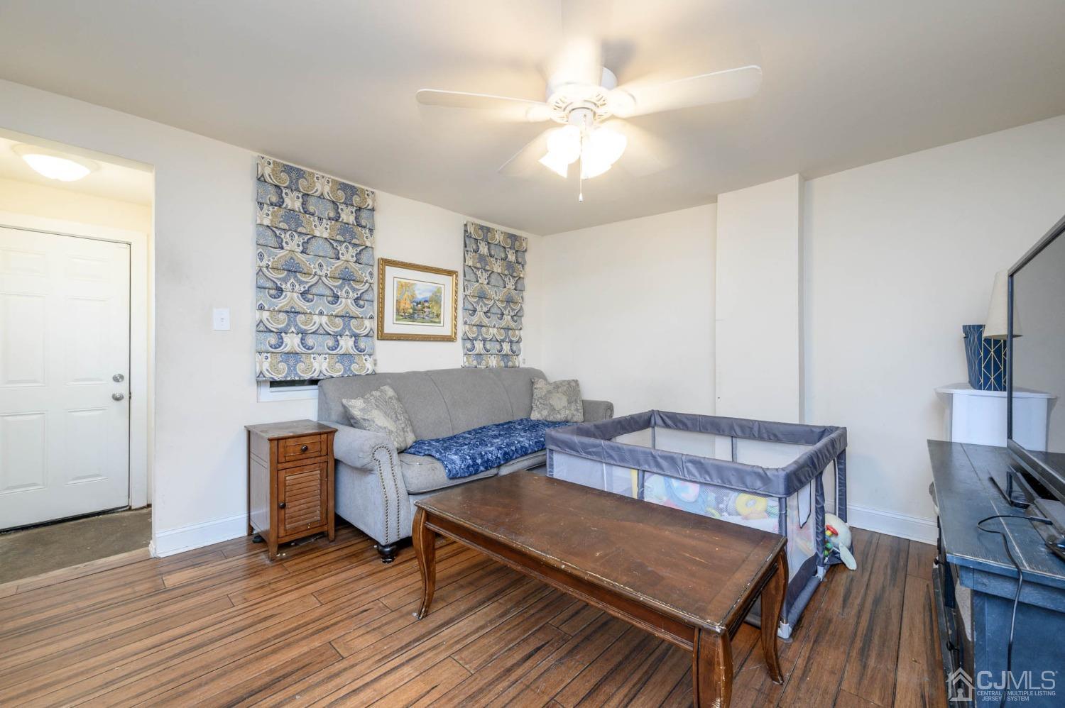 245 Washington Street Mount Holly, NJ 08060 - Photo 5 of 25 a living room with furniture and wooden floor