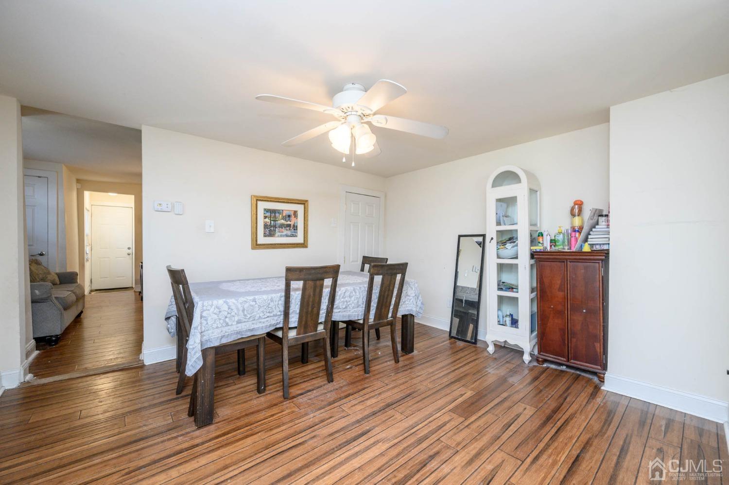 245 Washington Street Mount Holly, NJ 08060 - Photo 8 of 25 a dining room with furniture and wooden floor