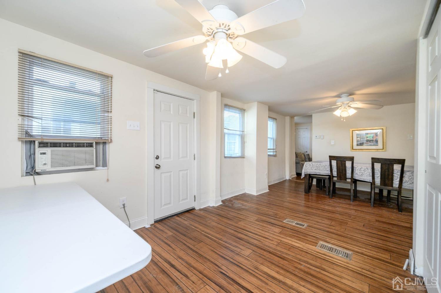 245 Washington Street Mount Holly, NJ 08060 - Photo 10 of 25 a view of dining room with wooden floor