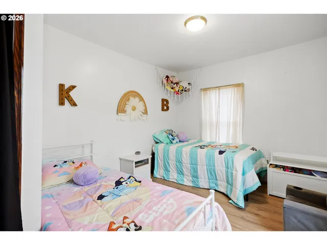 a bedroom with furniture and a window