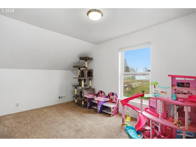 a view of a balcony with wooden floor