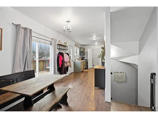 a living room with kitchen island furniture and a flat screen tv