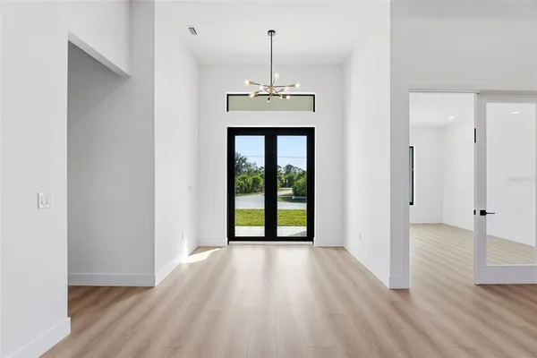 a view of a room with wooden floor and exposed radiator