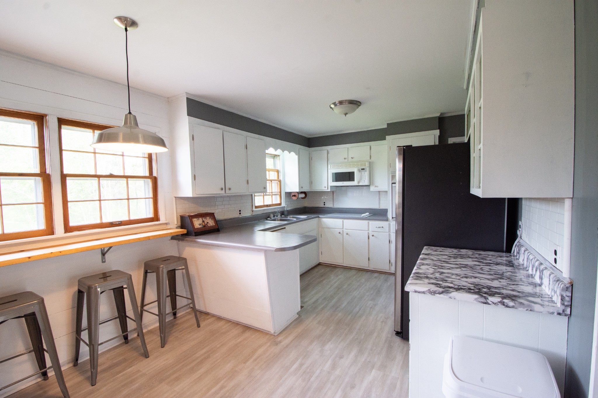 2012 Crescentview Road South Pulaski, TN 38478 - Photo 5 of 28 a kitchen with a table chairs refrigerator and window