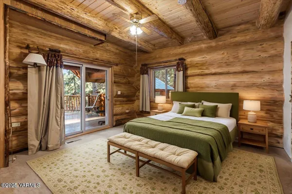 a bedroom with a bed and a mirror