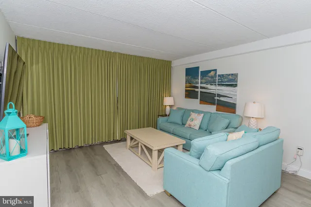 a kitchen with granite countertop a refrigerator stove and microwave