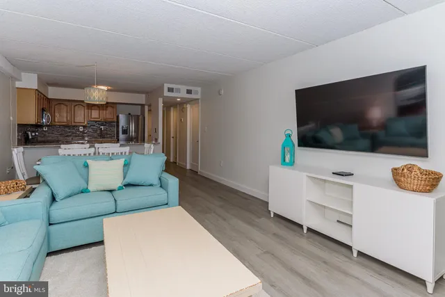 a kitchen with stainless steel appliances granite countertop a sink refrigerator and microwave