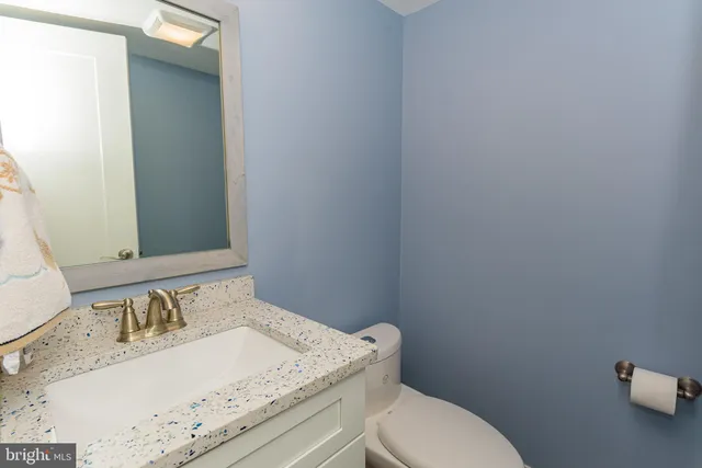 a view of a house with backyard and porch