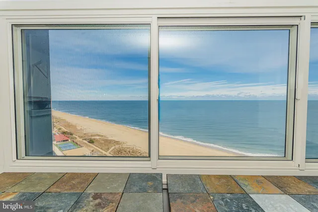 a view of a dining room with furniture and window