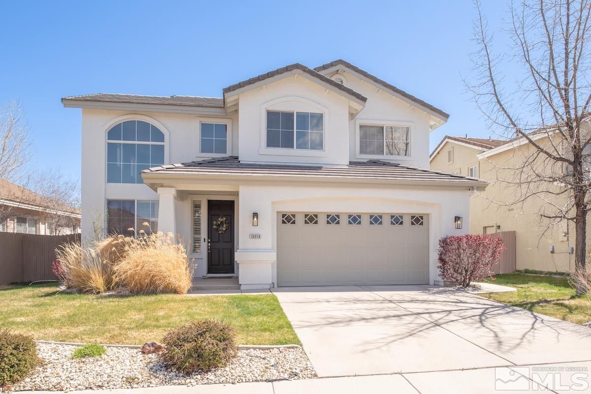 a view of a white house with a swimming pool and a yard