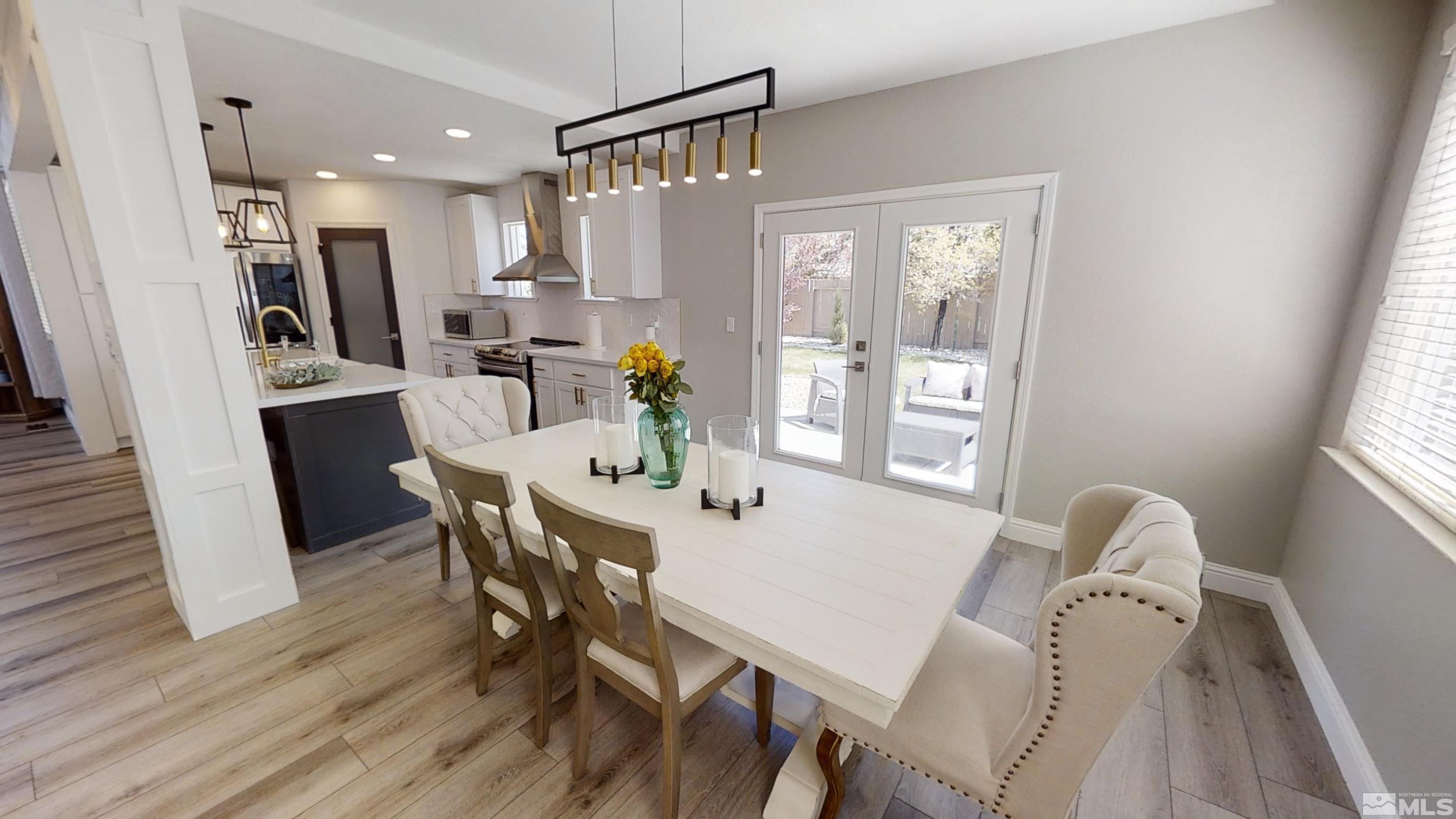 10018 Silver Star Drive Reno, NV 89521 - Photo 13 of 38 a view of a dining room with furniture and wooden floor