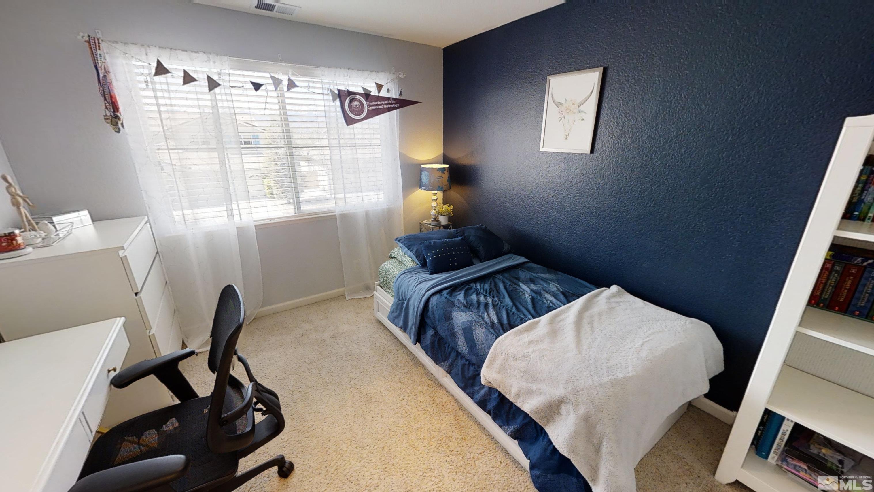 10018 Silver Star Drive Reno, NV 89521 - Photo 26 of 38 a bedroom with bed and a window