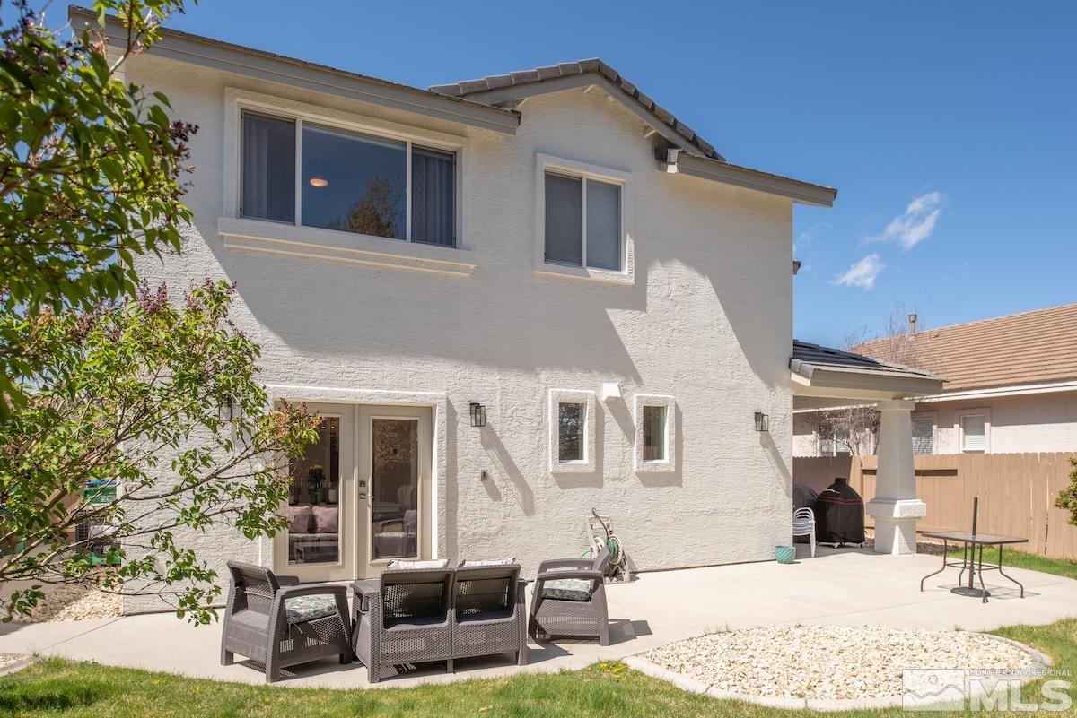 10018 Silver Star Drive Reno, NV 89521 - Photo 31 of 38 a view of a house with backyard porch and sitting area