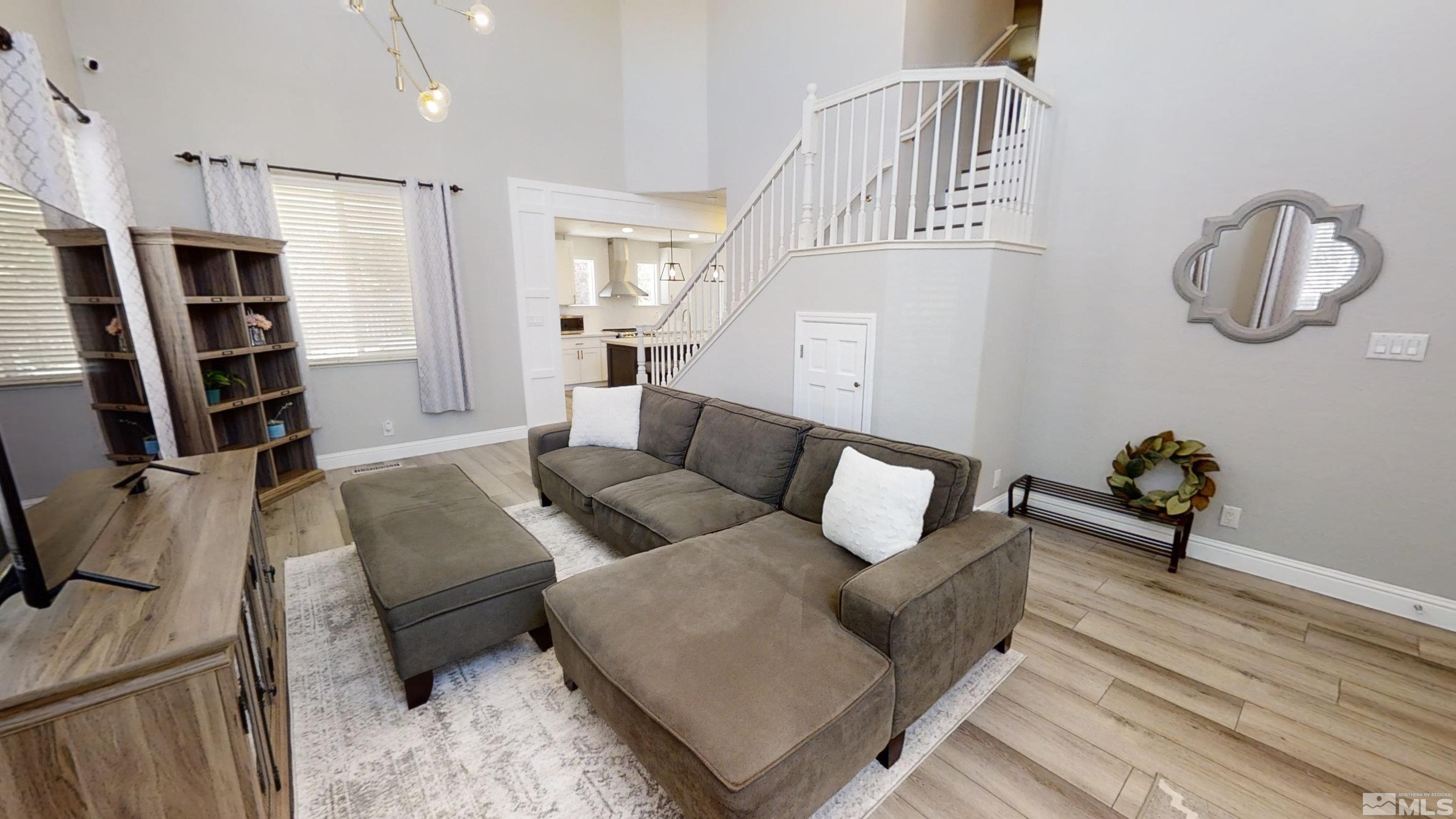10018 Silver Star Drive Reno, NV 89521 - Photo 6 of 38 a living room with furniture and a flat screen tv