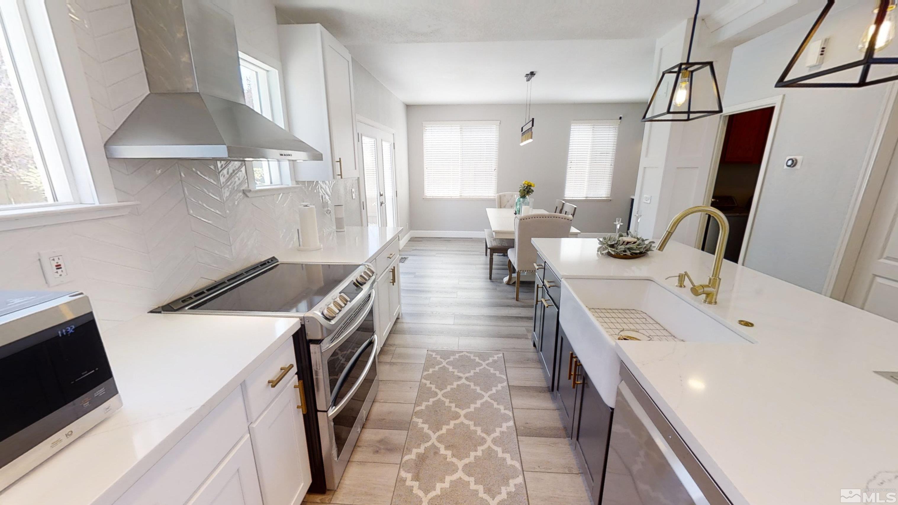 10018 Silver Star Drive Reno, NV 89521 - Photo 9 of 38 a kitchen with a sink a stove and a refrigerator