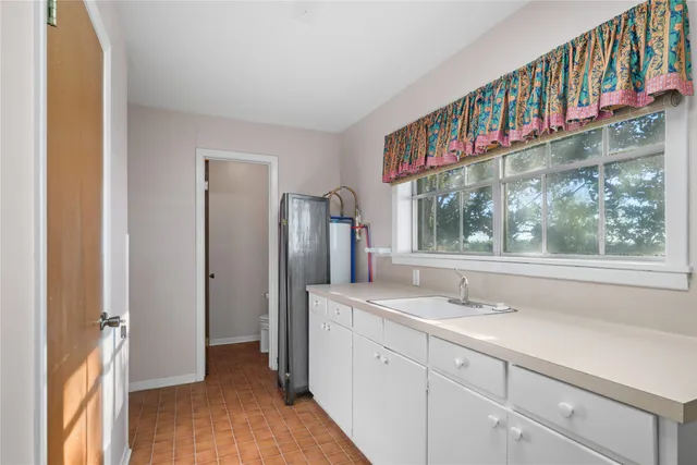 a bathroom with a sink and a large mirror