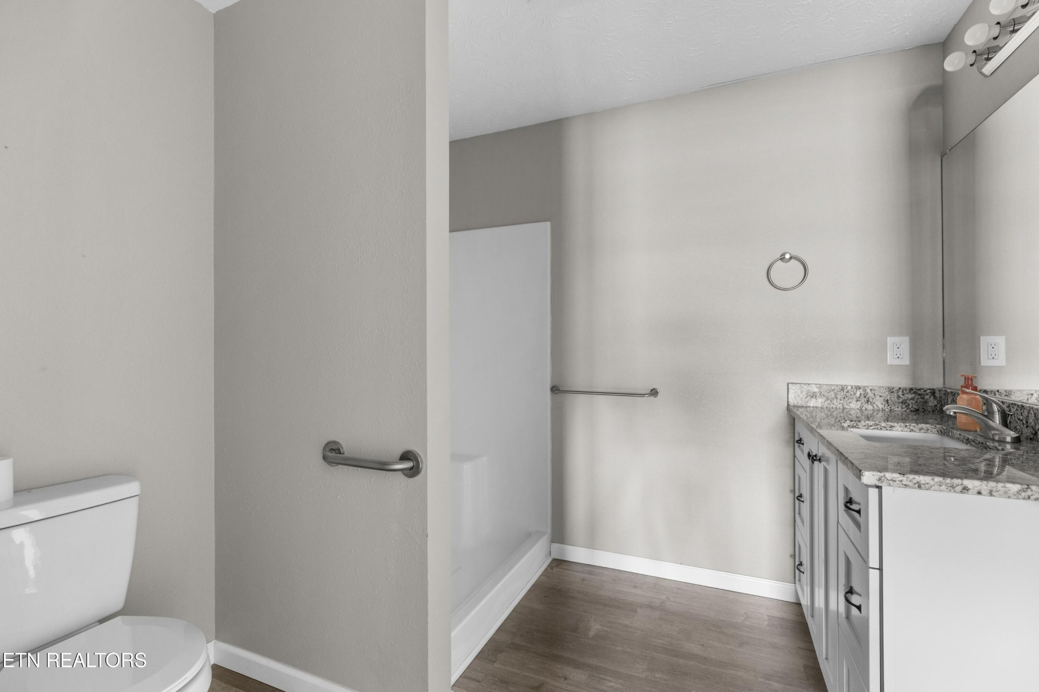 1159 Camellia Road Newport, TN 37821 - Photo 41 of 45 a bathroom with a granite countertop sink toilet and shower