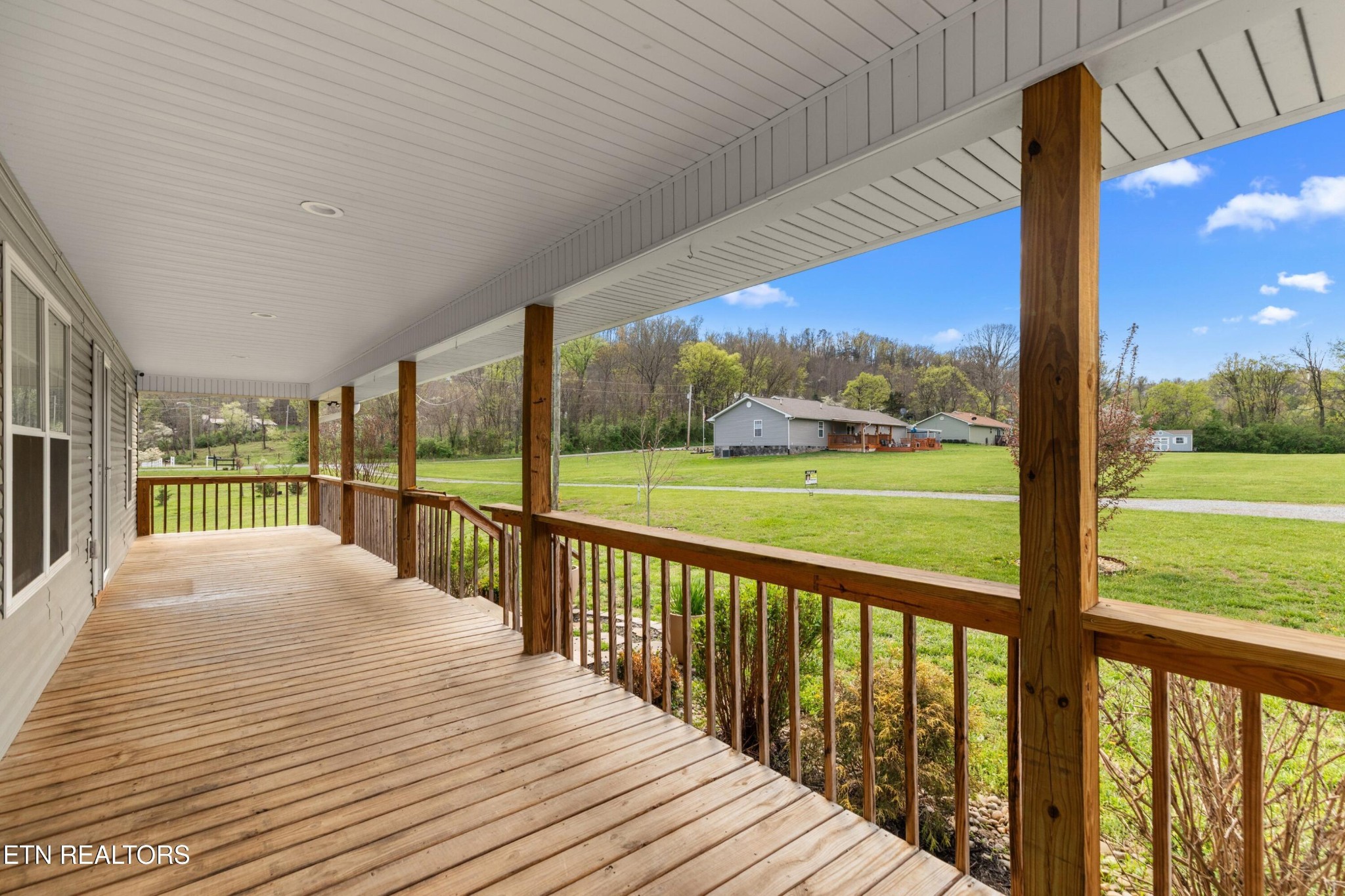 1159 Camellia Road Newport, TN 37821 - Photo 6 of 45 a view of balcony with floor to ceiling windows with wooden fence