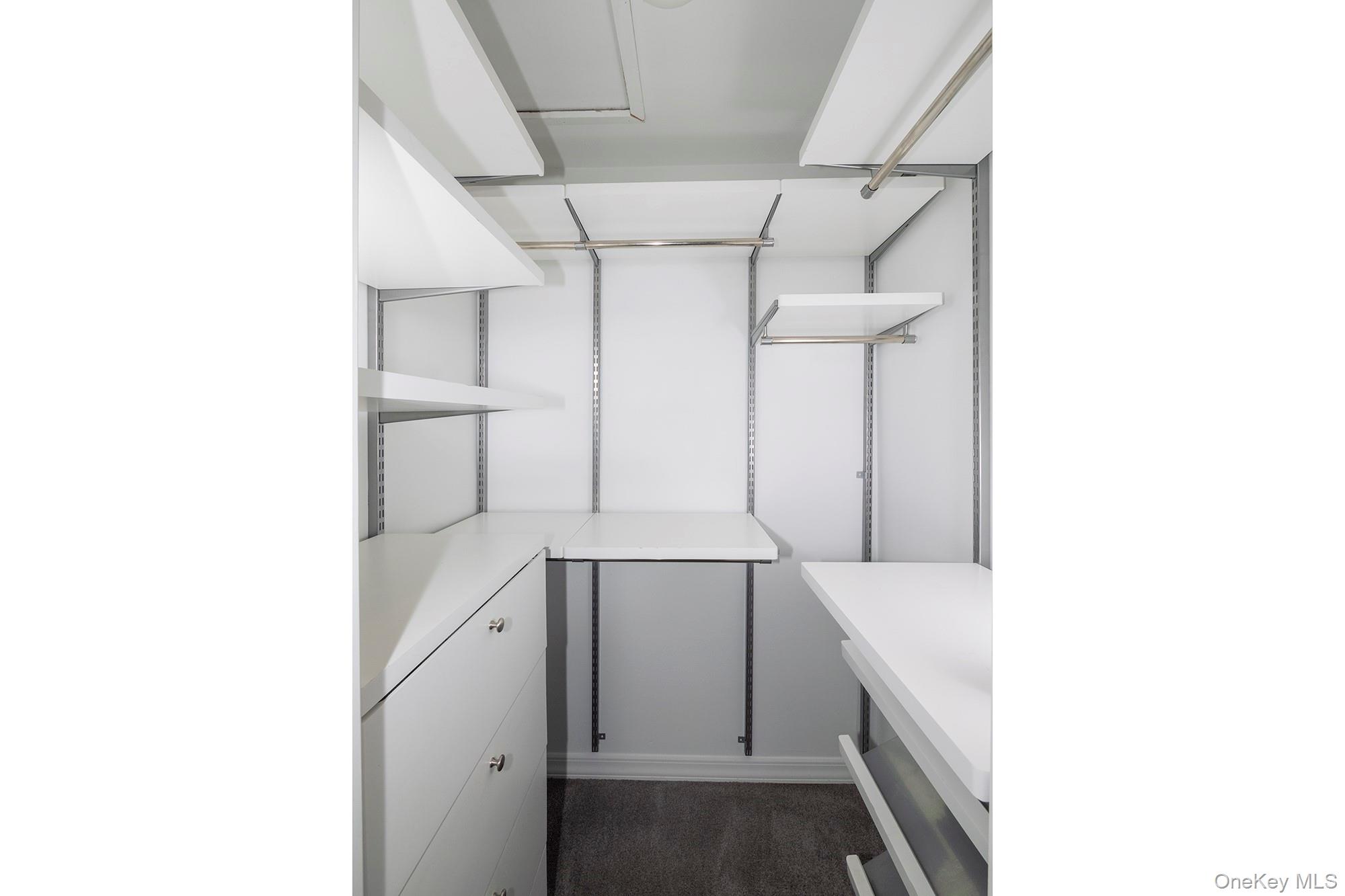 425 Newbridge Road, Unit 37 East Meadow, NY 11554 - Photo 7 of 8 a bathroom with a sink and mirror