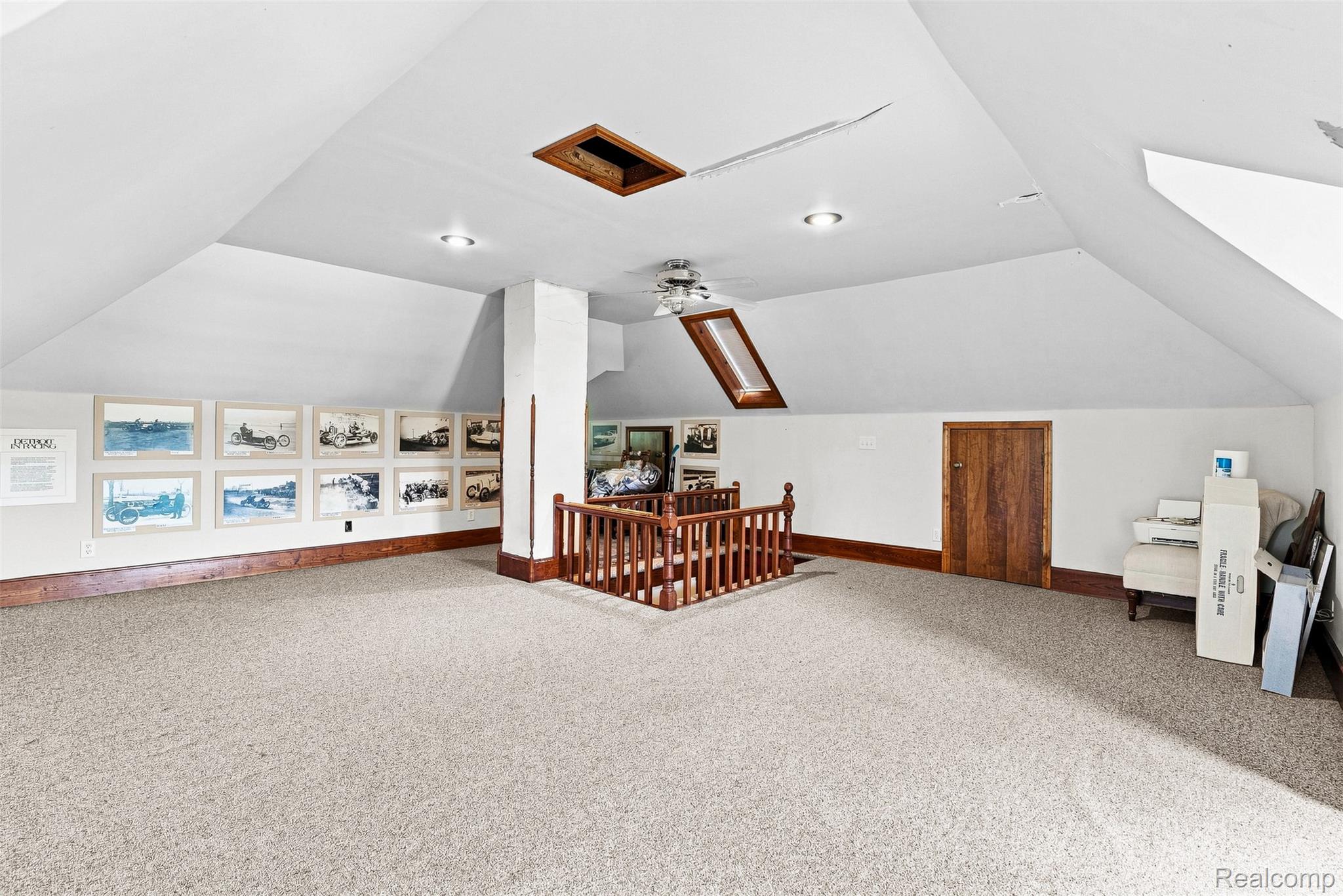 2971 Huron Line Road Cass City, MI 48726 - Photo 34 of 63 Carpeted room with sloped ceilings, recessed lighting, wood-finish trim, and a wood-finish railing