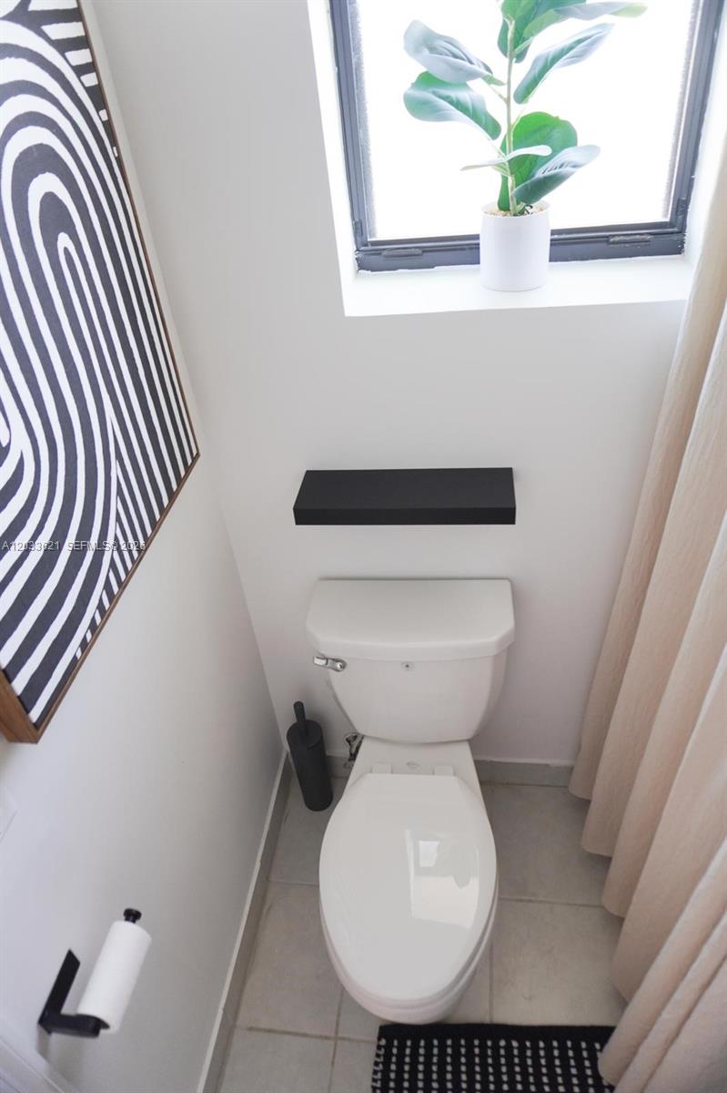 11942 Southwest 243rd Street Homestead, FL 33032 - Photo 32 of 50 a bathroom with a toilet and a sink