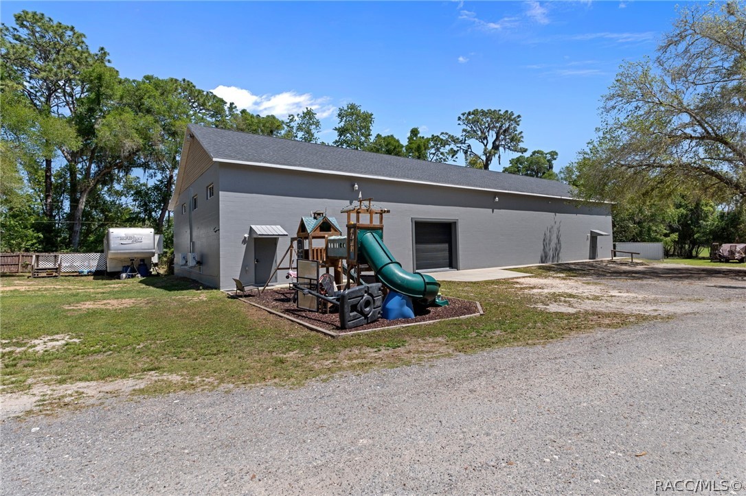 4530 South Florida Avenue Inverness, FL 34450 - Photo 55 of 100 a view of a house with basket ball court and a yard