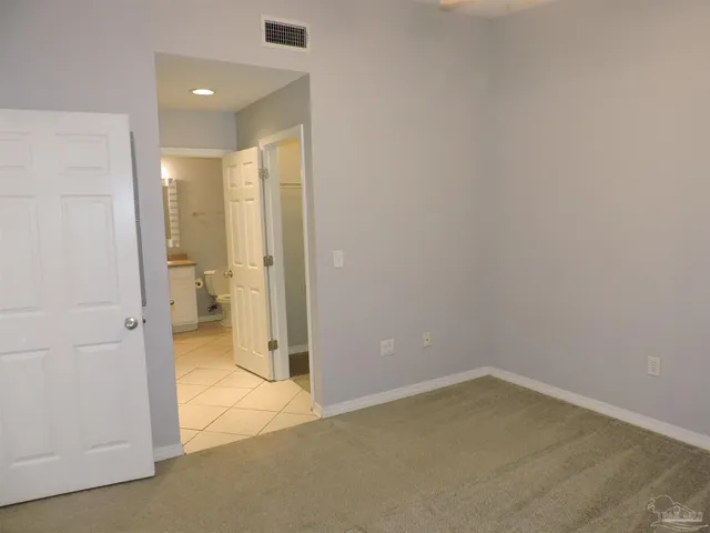 a view of a bathroom with a glass door and a yard