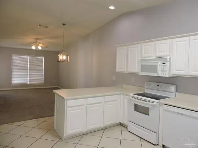 a kitchen that has a sink and a stove