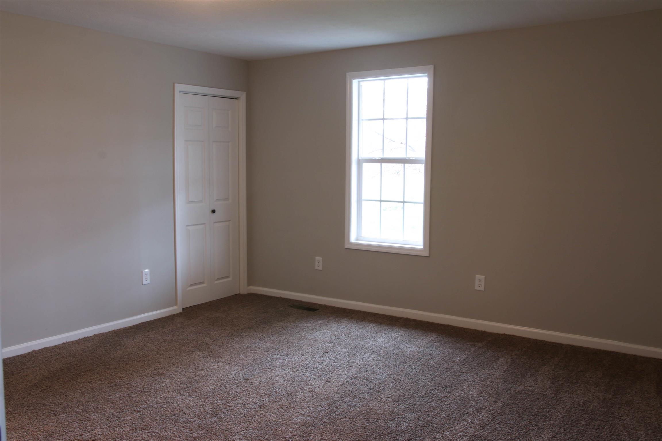 3801 Felts Road Cedar Hill, TN 37032 - Photo 8 of 10 an empty room with a window