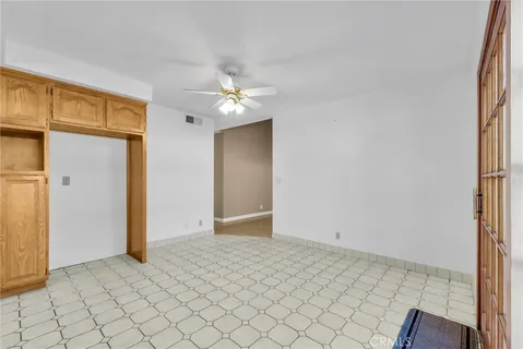 an empty room with fan