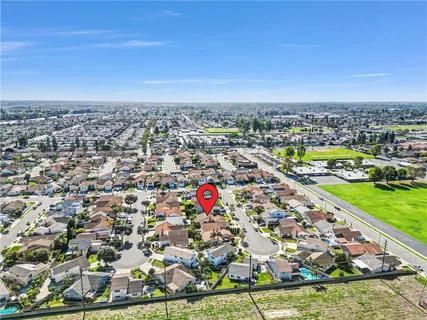 an aerial view of residential building and lake