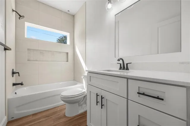 a bathroom with a sink a toilet and a bathtub