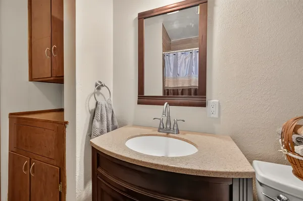 a bathroom with a sink and a mirror