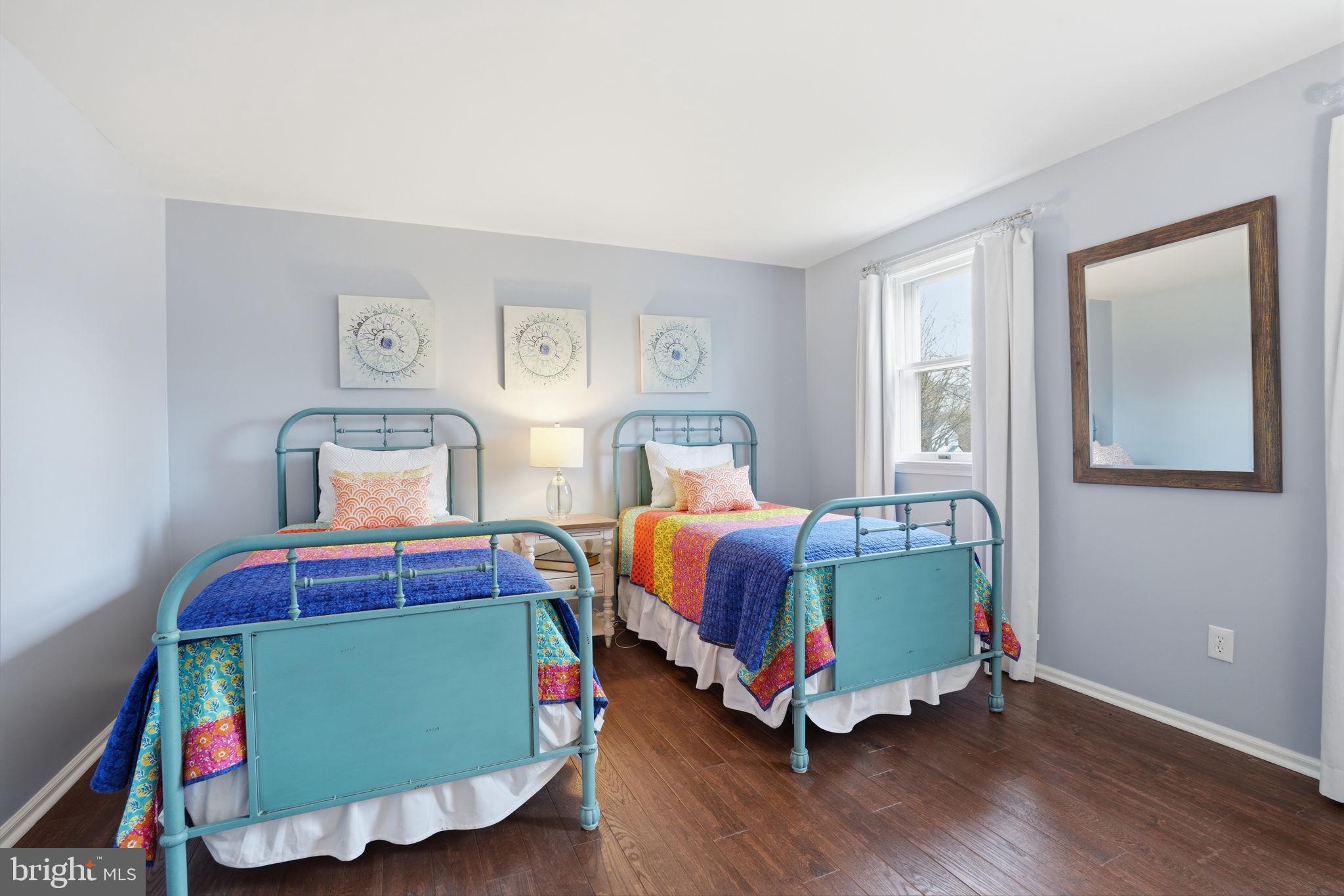 1431 Silo Road Yardley, PA 19067 - Photo 16 of 32 a bedroom with a bed and wooden floor