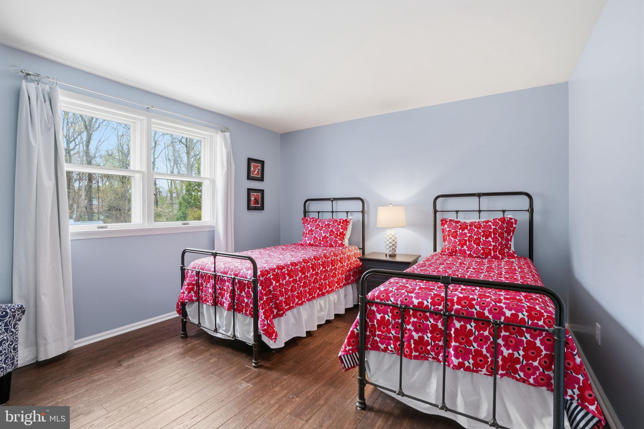 1431 Silo Road Yardley, PA 19067 - Photo 17 of 32 a bedroom with two beds and wooden floor