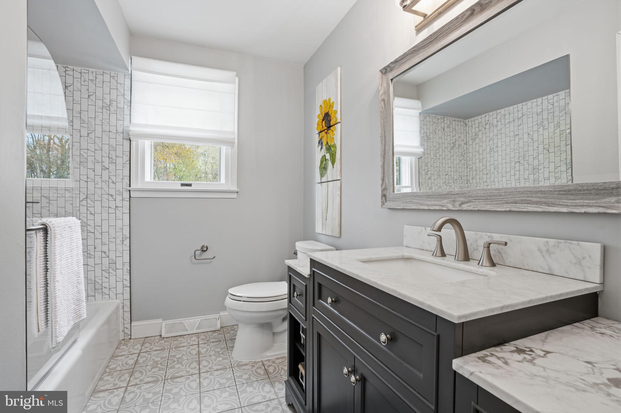 1431 Silo Road Yardley, PA 19067 - Photo 19 of 32 a bathroom with a sink and a toilet