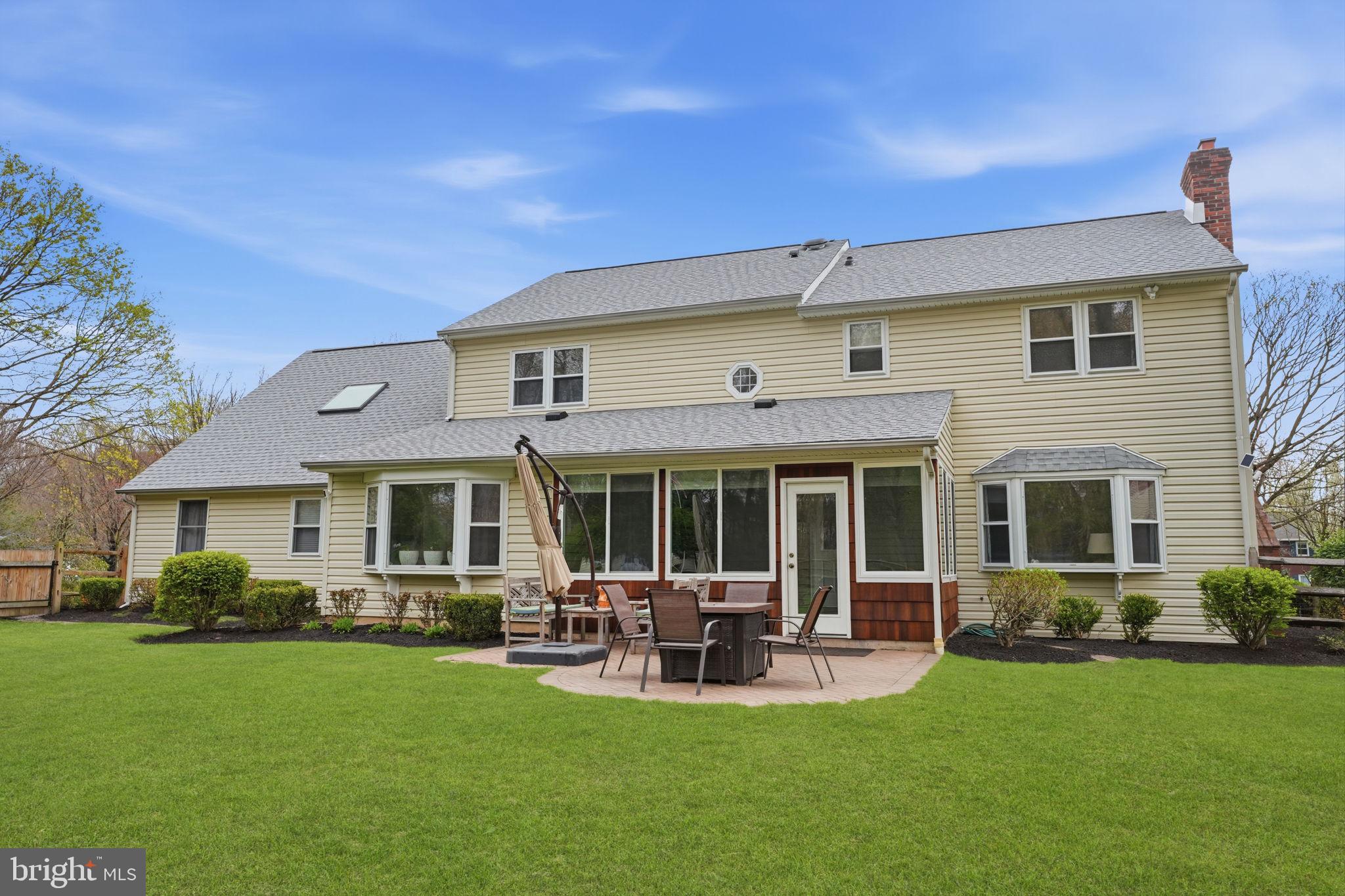 1431 Silo Road Yardley, PA 19067 - Photo 24 of 32 a view of a house with a patio and a yard