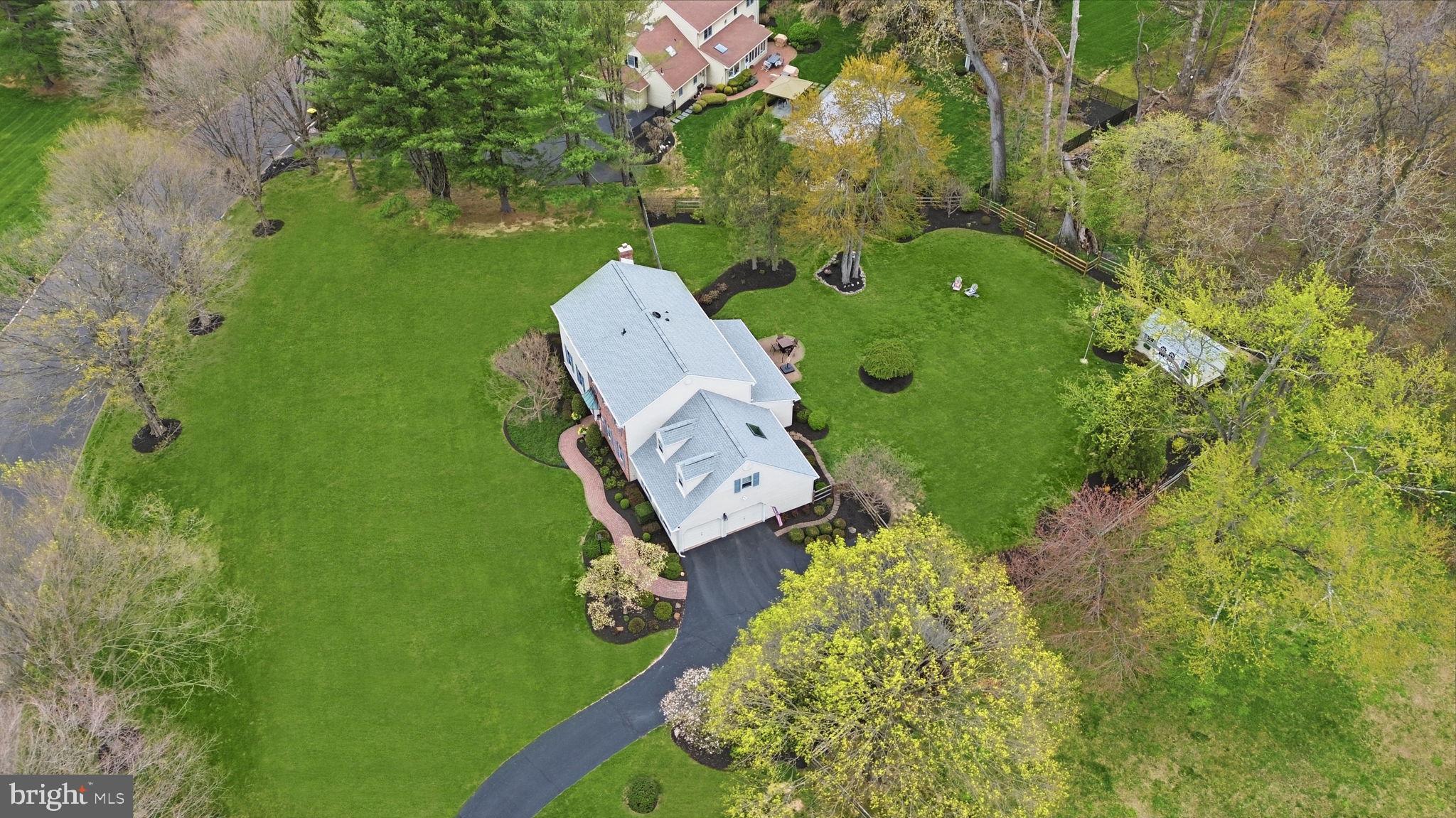 1431 Silo Road Yardley, PA 19067 - Photo 25 of 32 an aerial view of a house with a yard basket ball court and outdoor seating