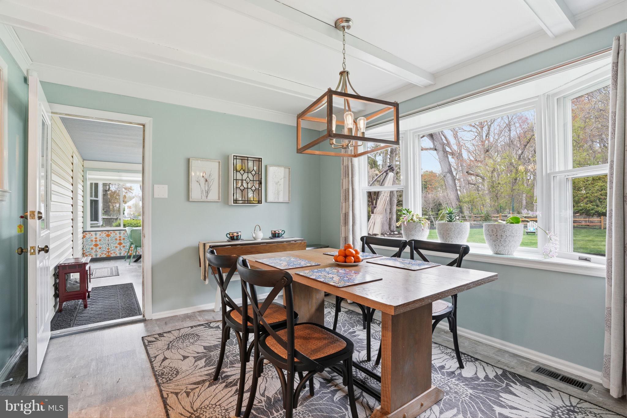 1431 Silo Road Yardley, PA 19067 - Photo 9 of 32 a dining room with furniture a chandelier and wooden floor