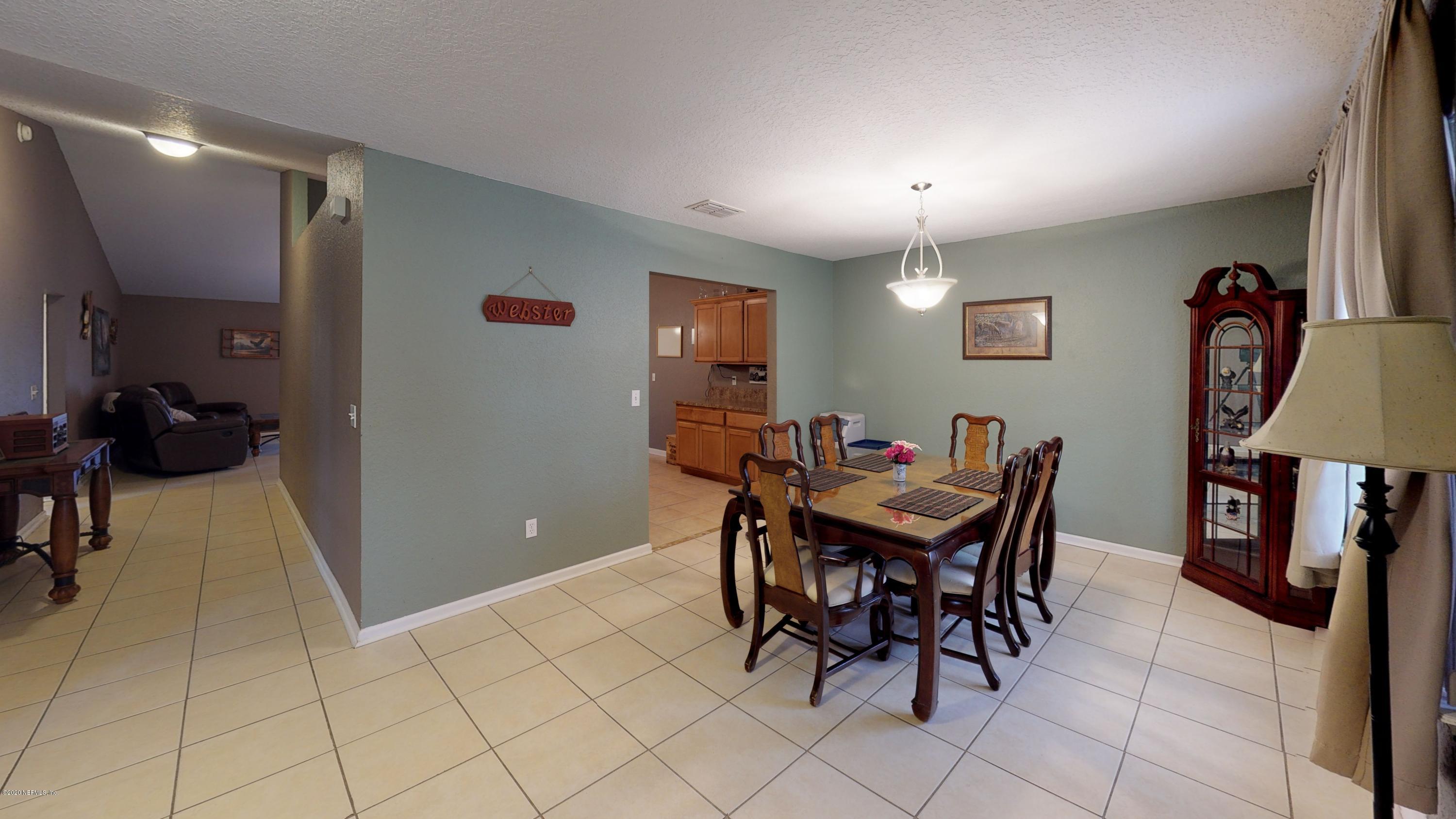 3990 Bronco Road Middleburg, FL 32068 - Photo 28 of 40 a view of a dining room with furniture